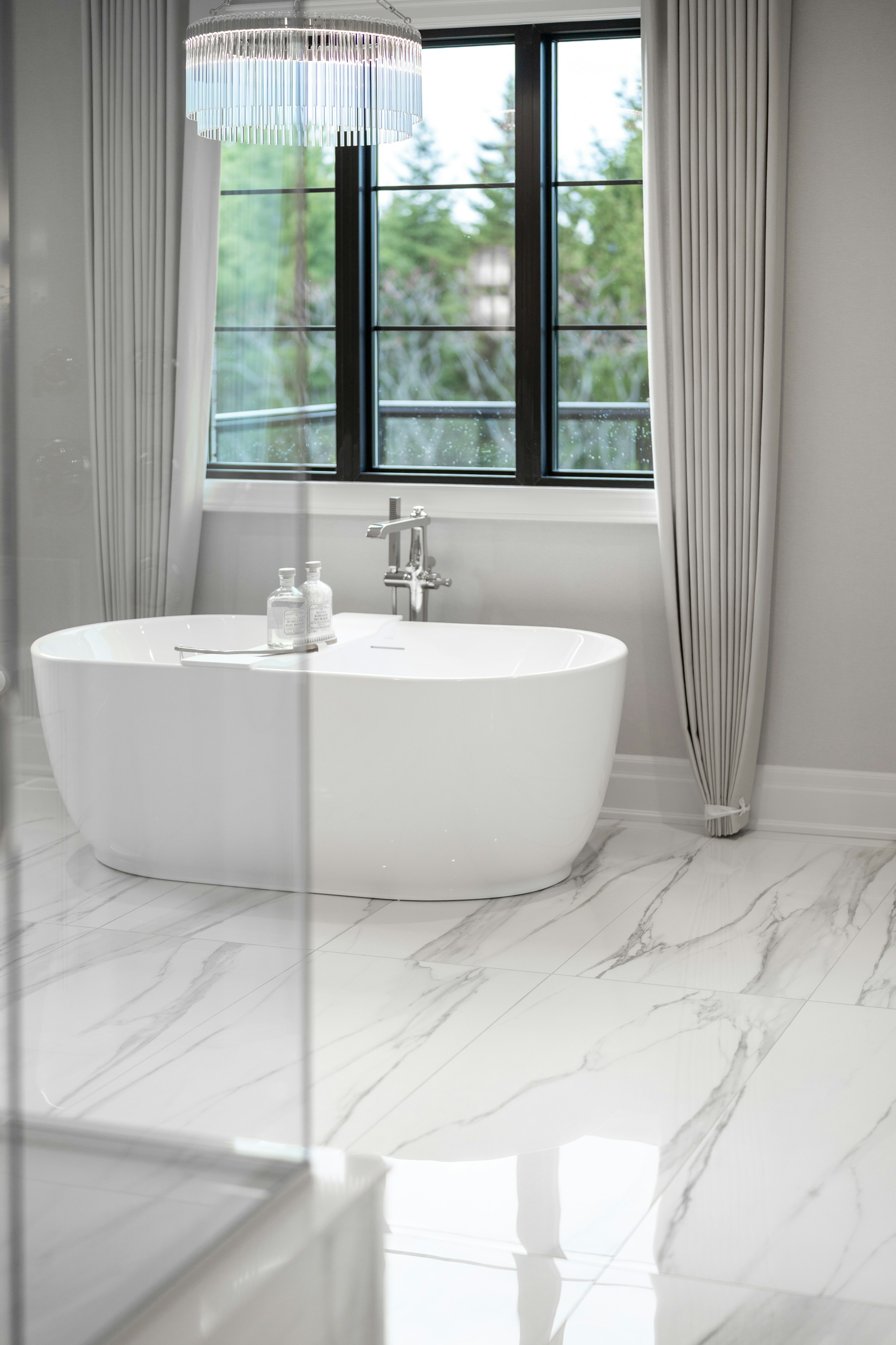 Light-filled bathroom with a freestanding bath and chrome tap